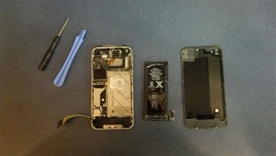 Phone opened for repair with tools